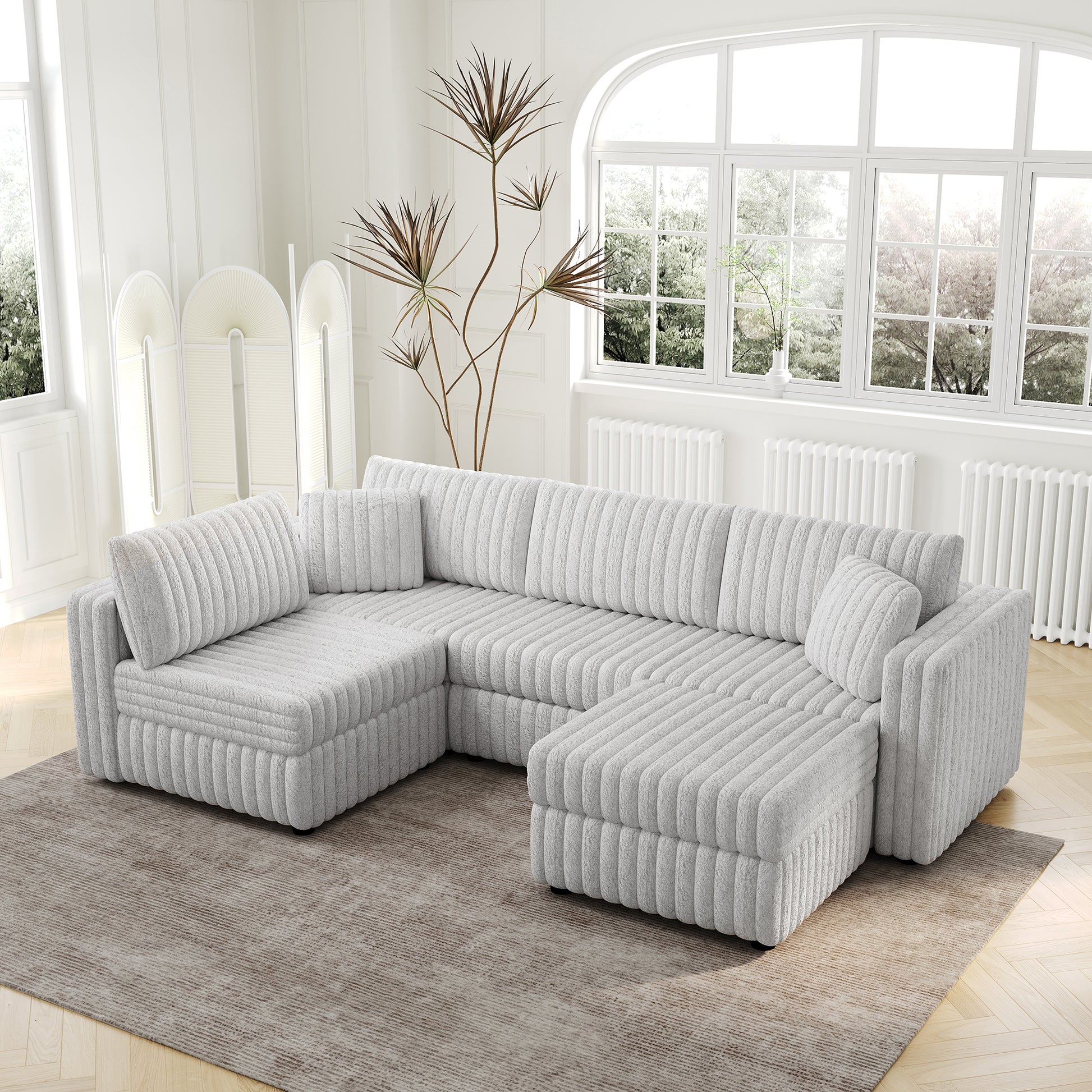 Plush grey sectional sofa with channel tufting and modular design