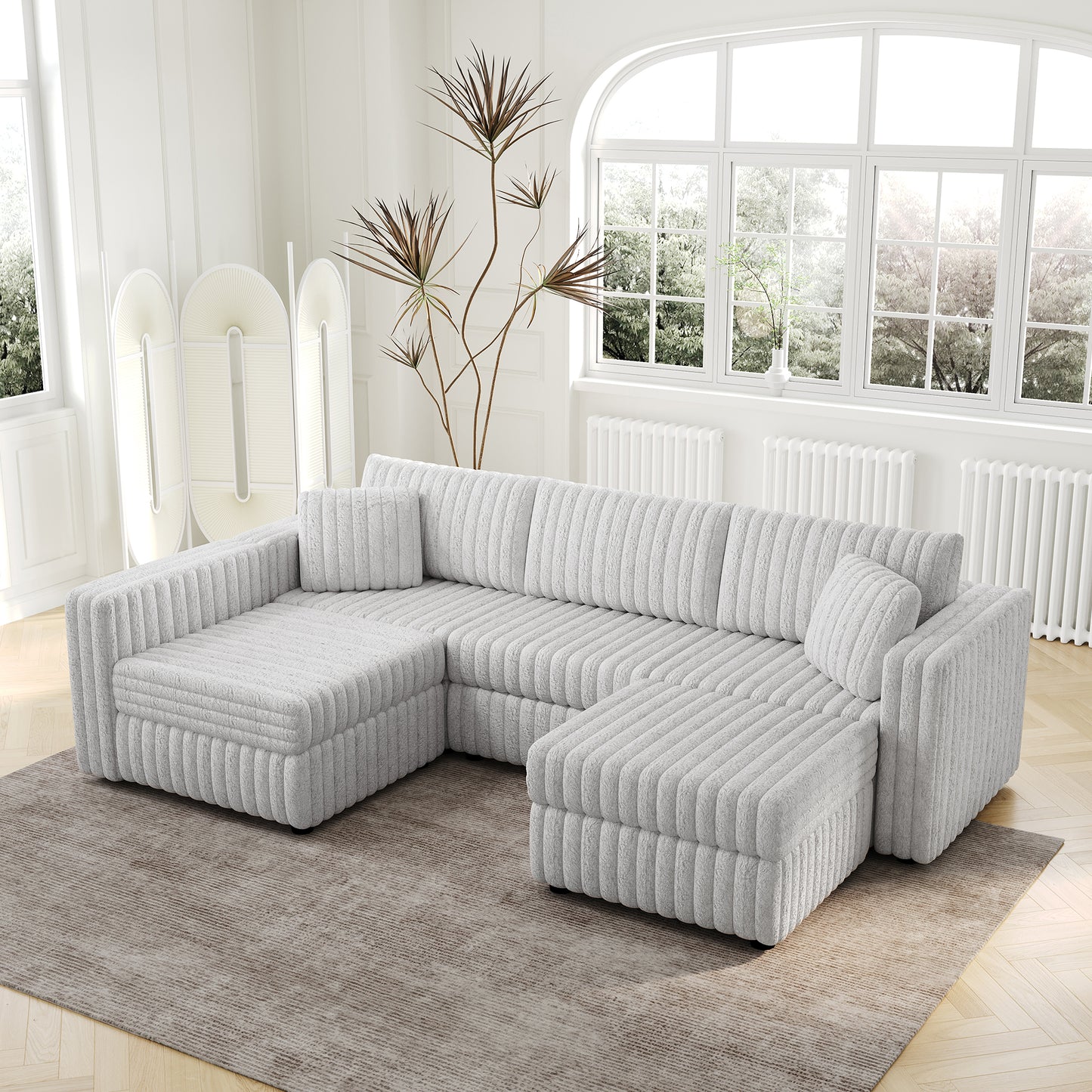 Plush grey sectional sofa with corduroy texture and matching throw pillows
