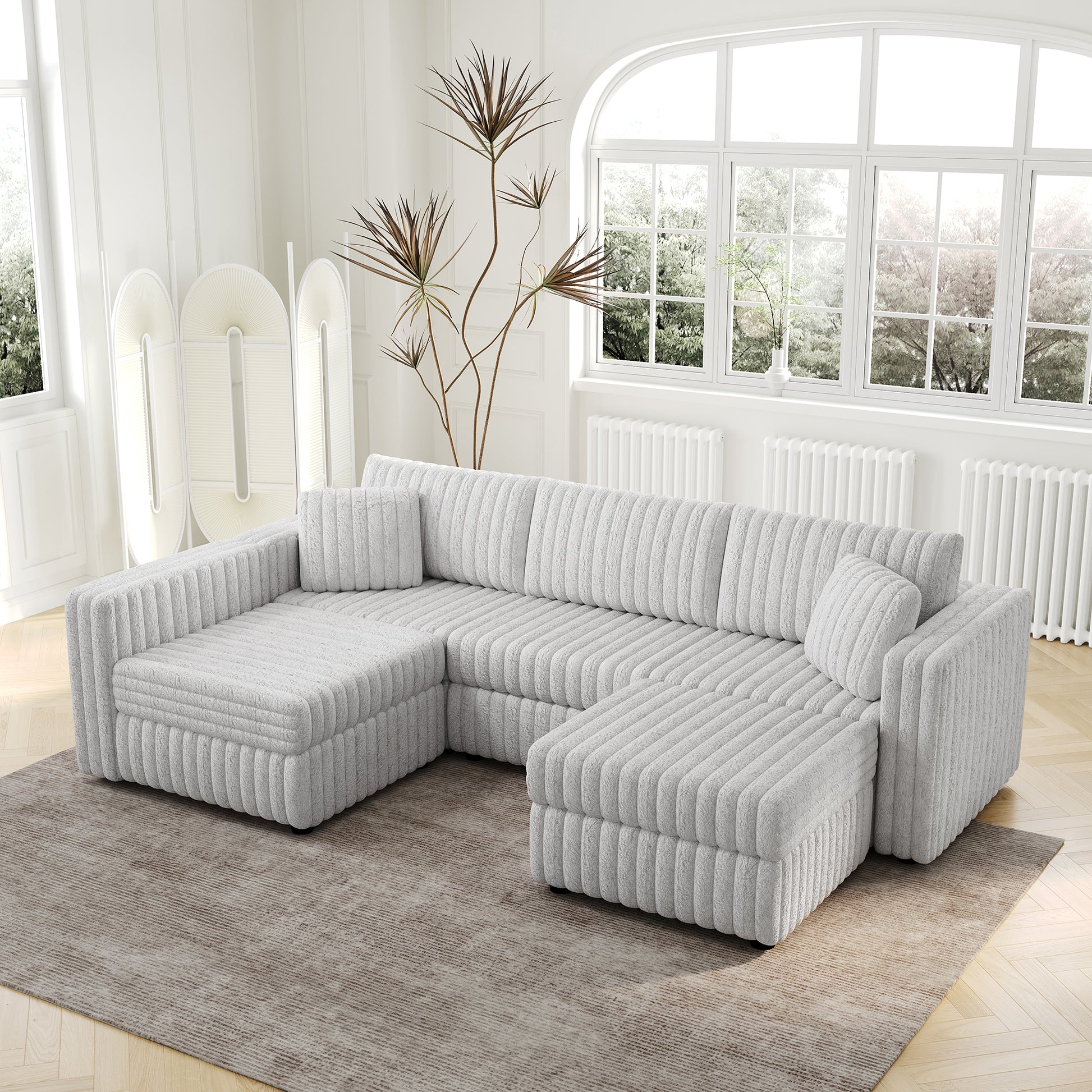 Plush grey sectional sofa with corduroy texture and matching throw pillows