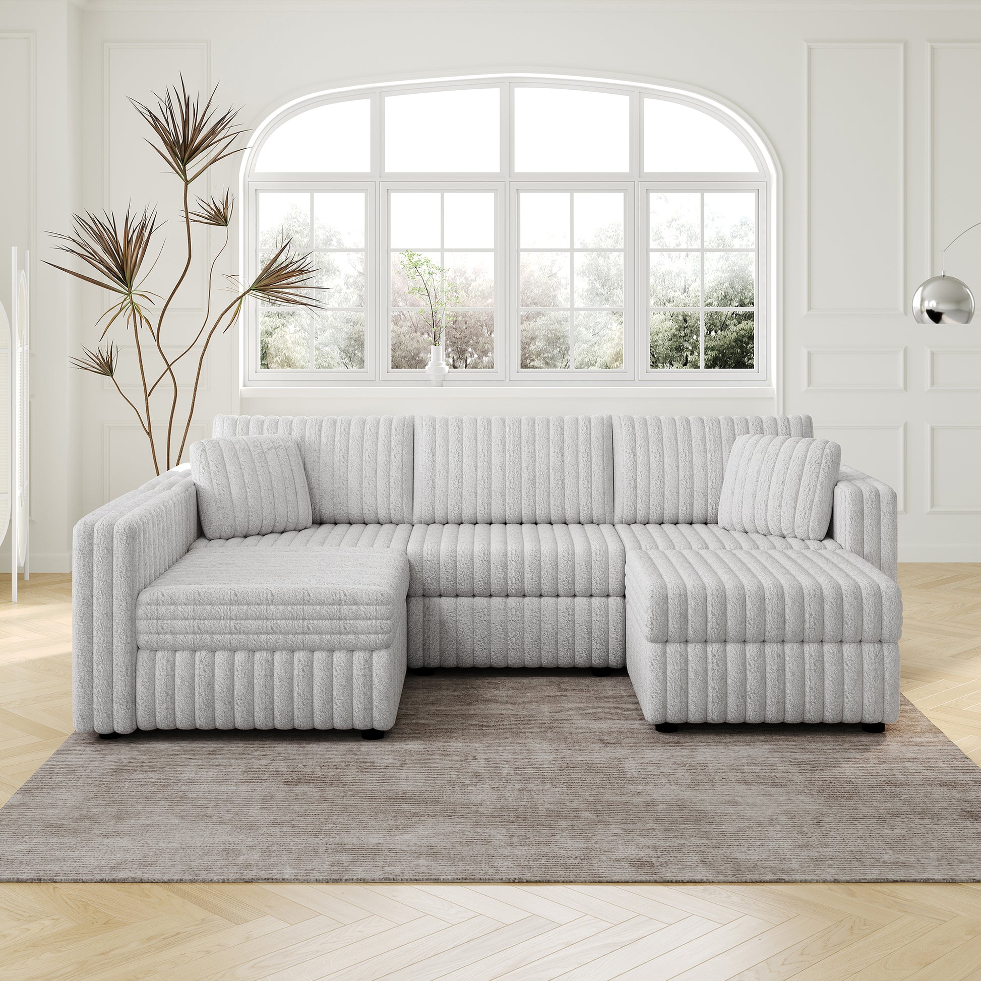 Plush white sectional sofa with ribbed upholstery and matching throw pillows