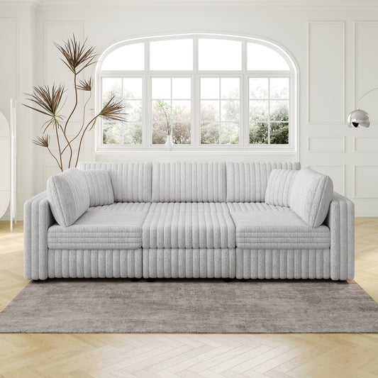 Fluffy light grey sectional sofa with plush cushions and ribbed texture perfect for modern living rooms
