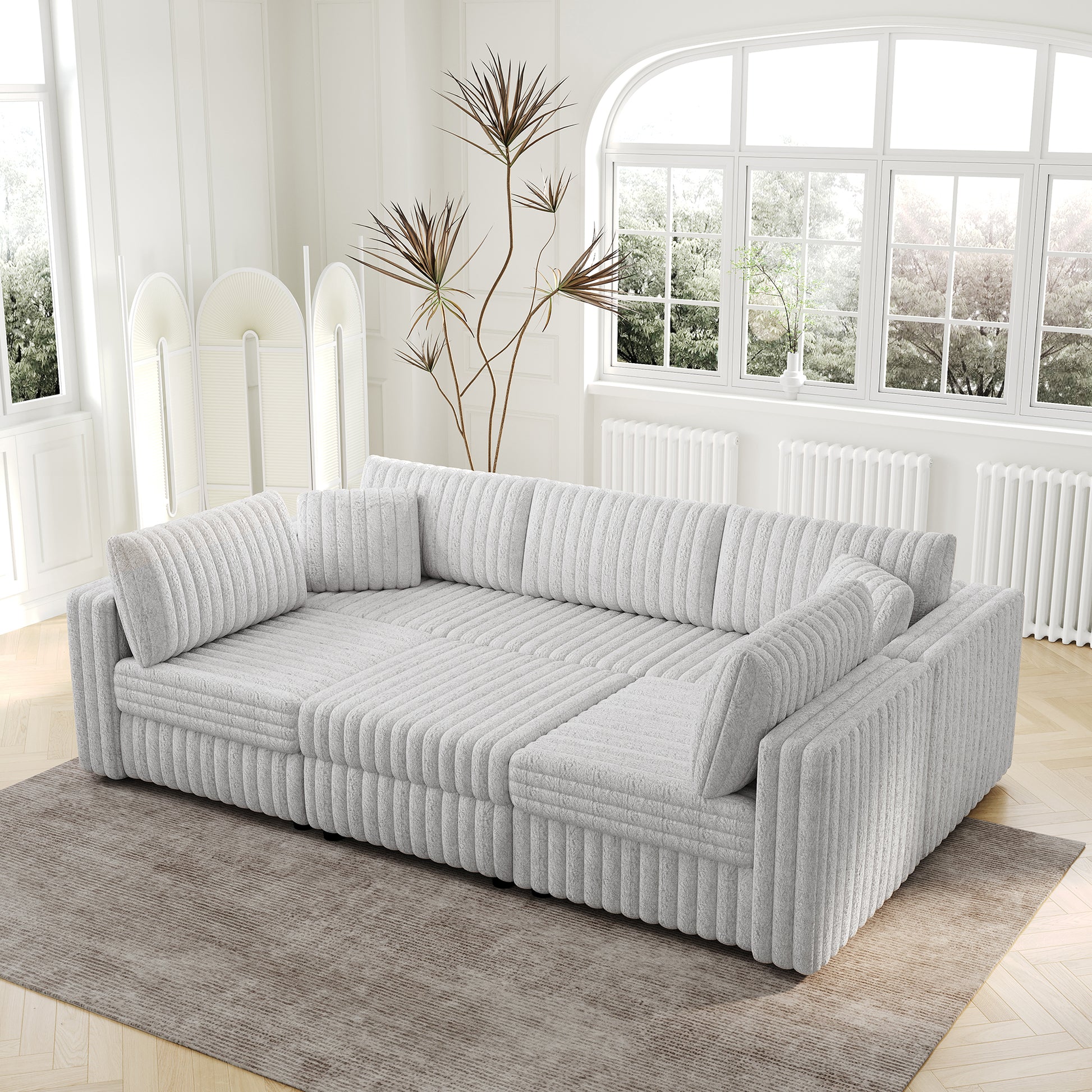 Plush grey sectional sofa with channel tufting perfect for modern living rooms