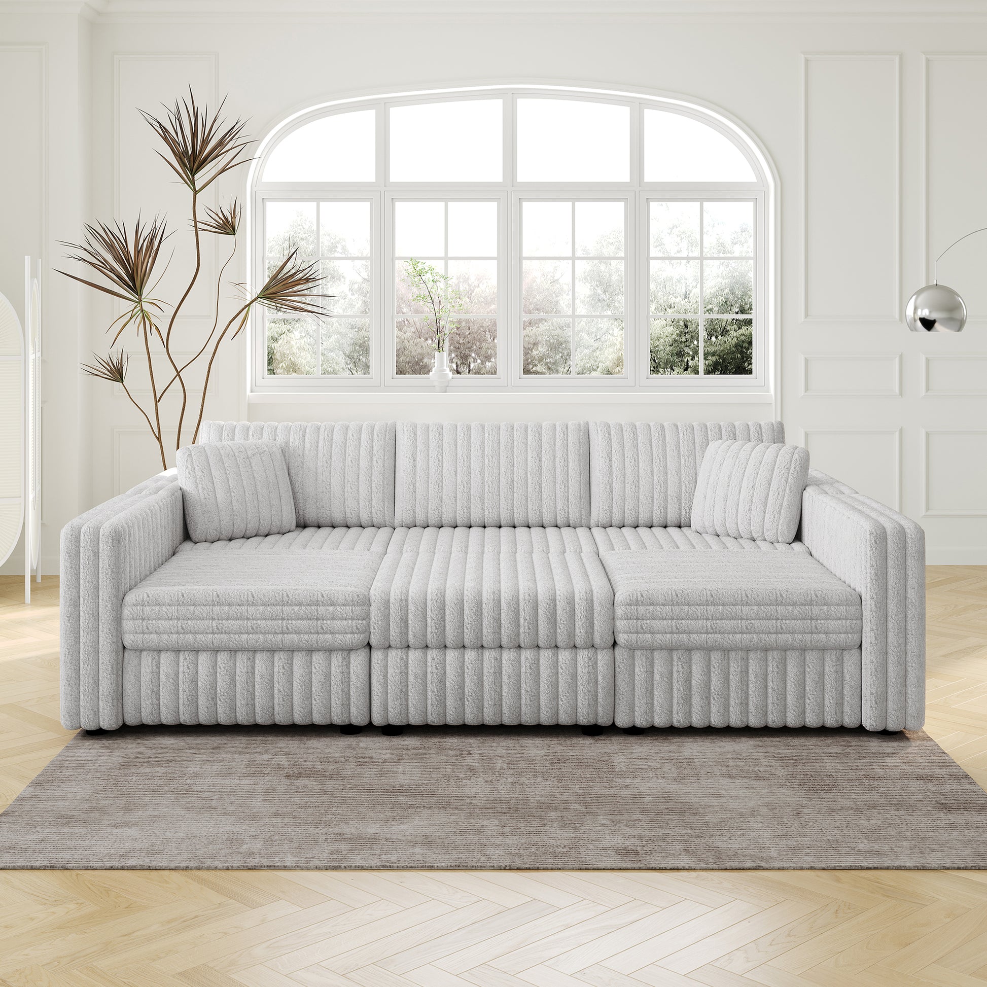 Plush grey sectional sofa with ribbed upholstery and modern design