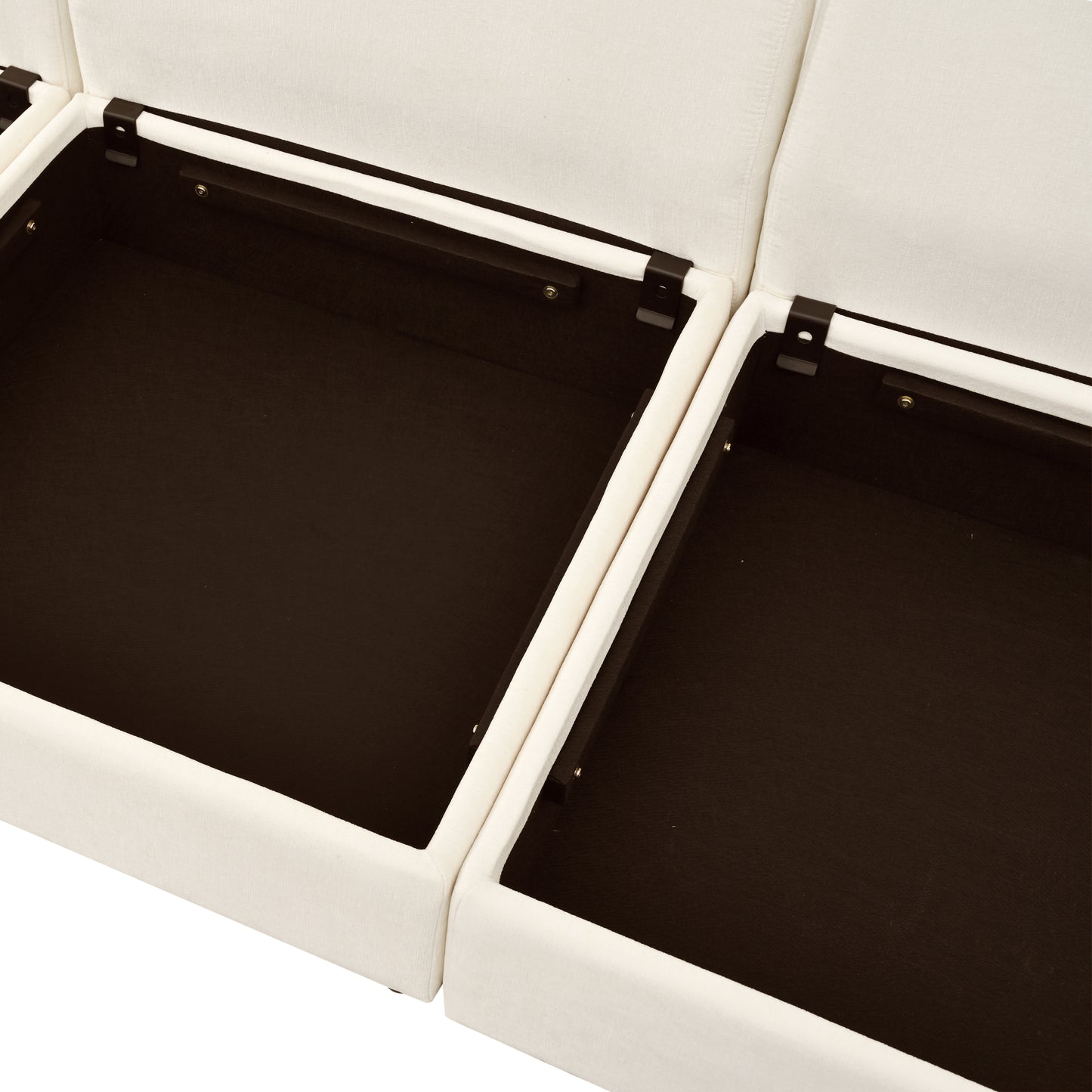 Closeup of open cream fabric storage ottoman with dark brown interior compartments