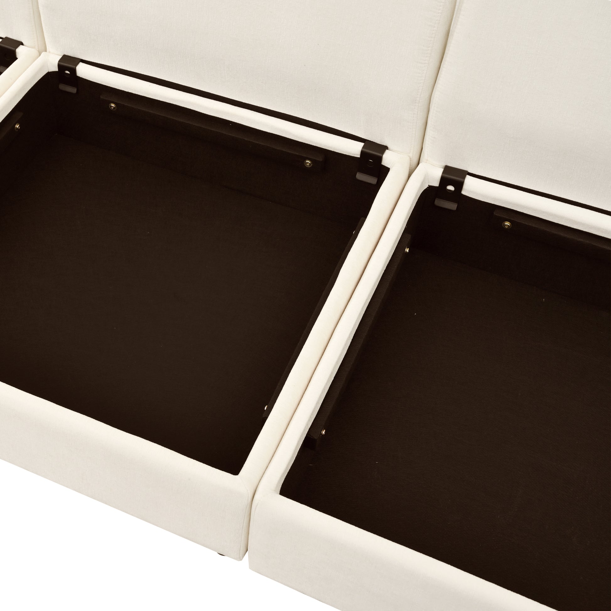Closeup of open cream fabric storage ottoman with dark brown interior compartments