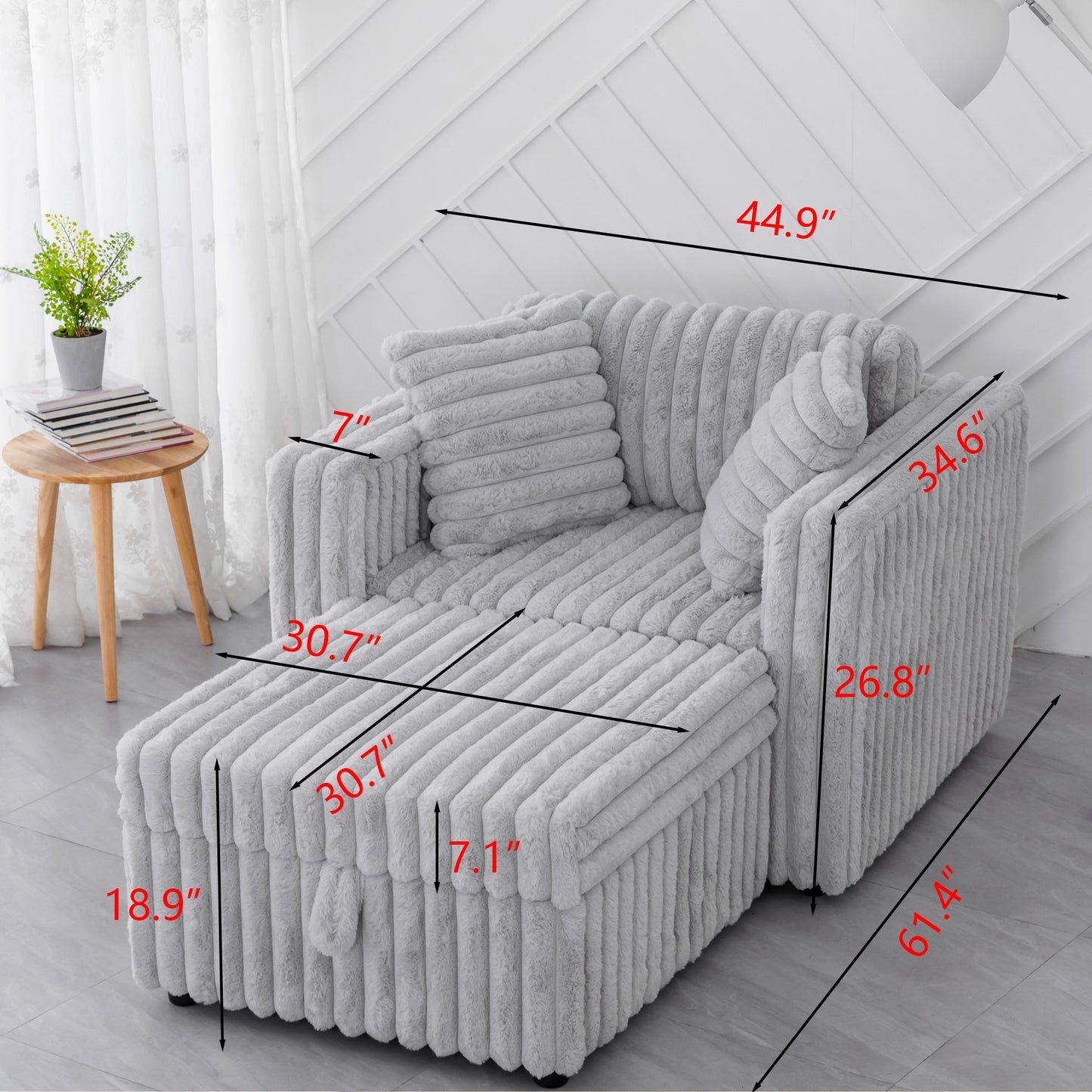 Grey plush fabric sofa with pullout ottoman perfect for small spaces