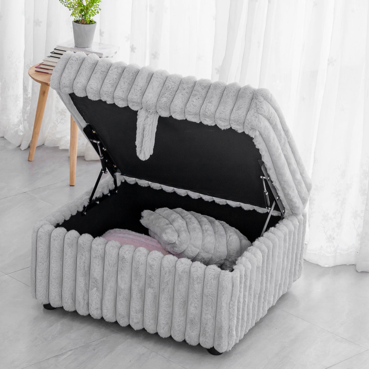 Plush grey storage ottoman with plush ribbed exterior and lifting lid ideal for toy organization