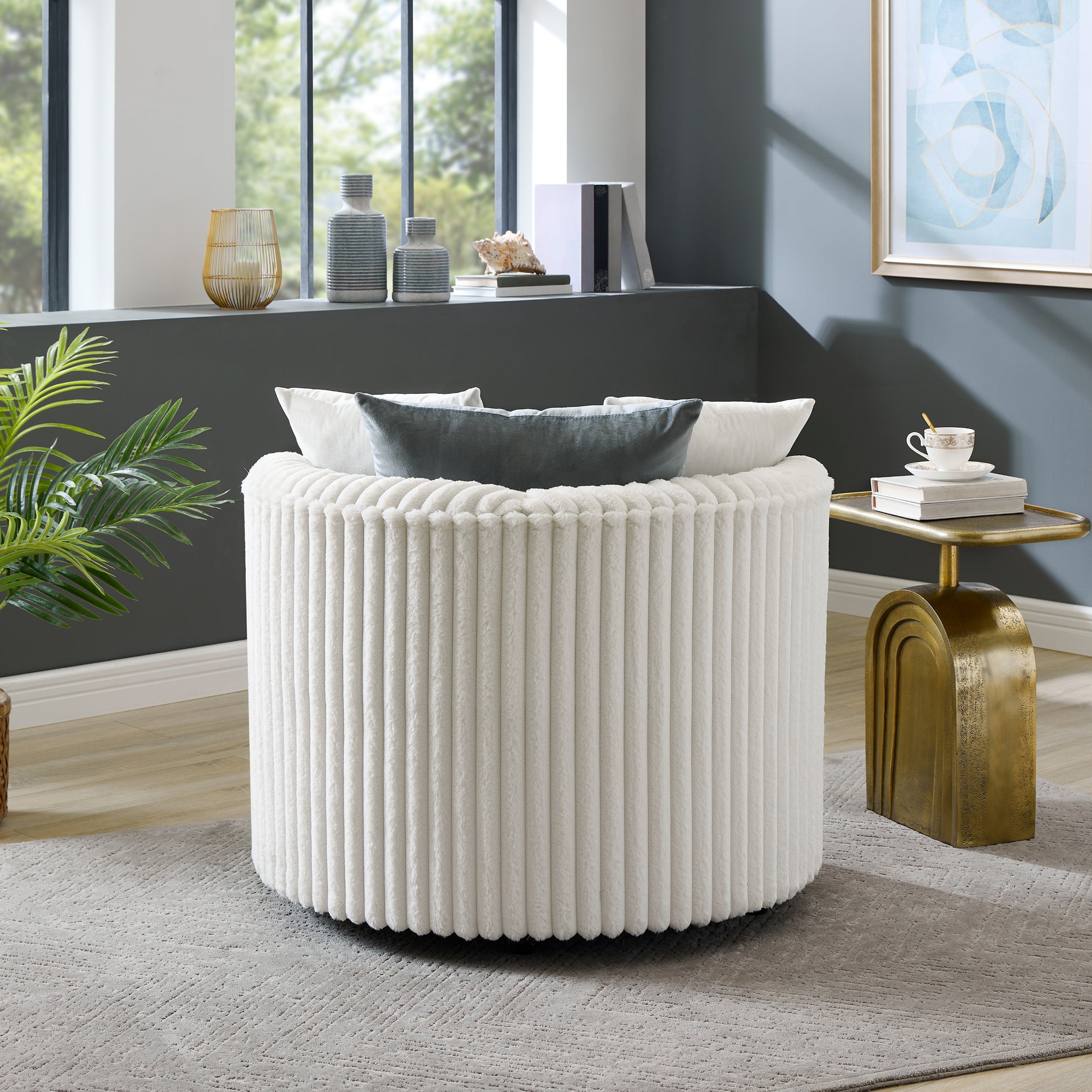 Plush white round ottoman with vertical ribbed texture perfect for modern living rooms