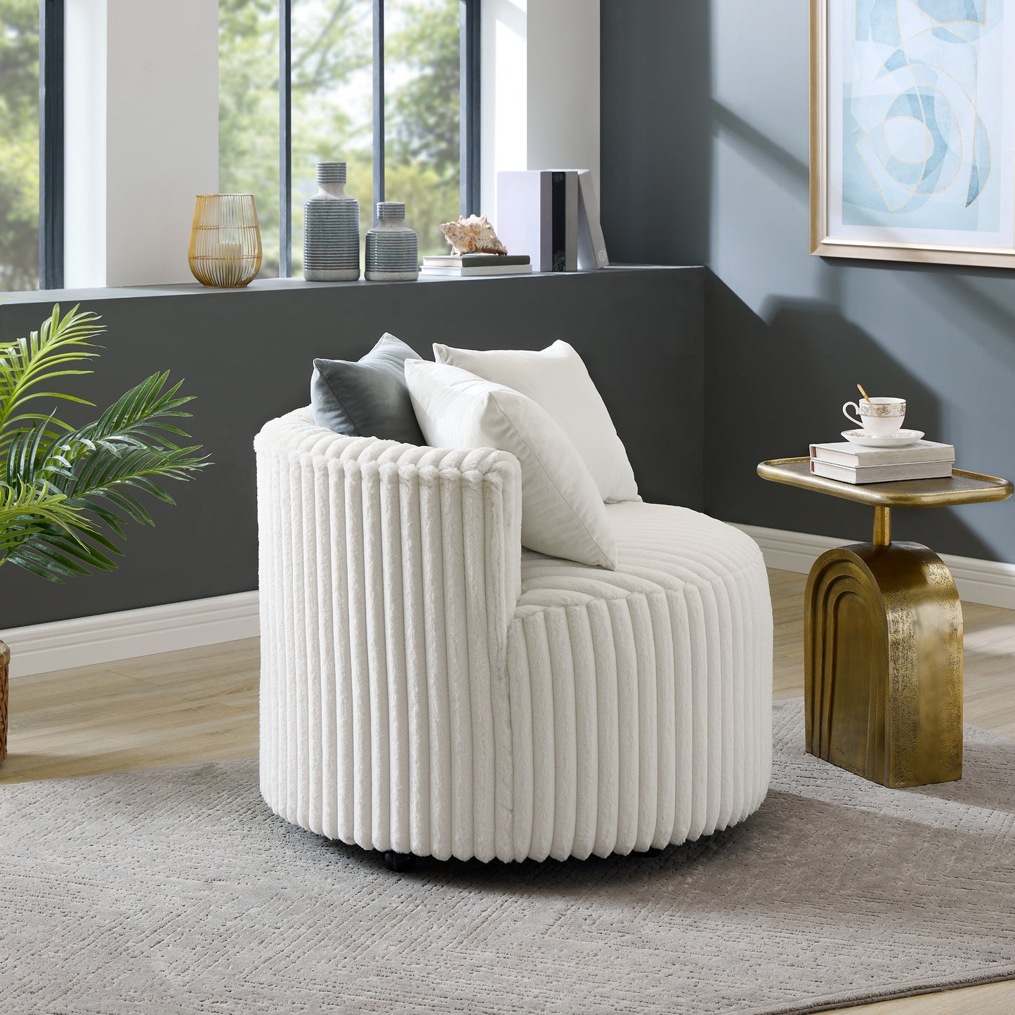 White corduroy swivel armchair with plush pillows for a cozy living room accent
