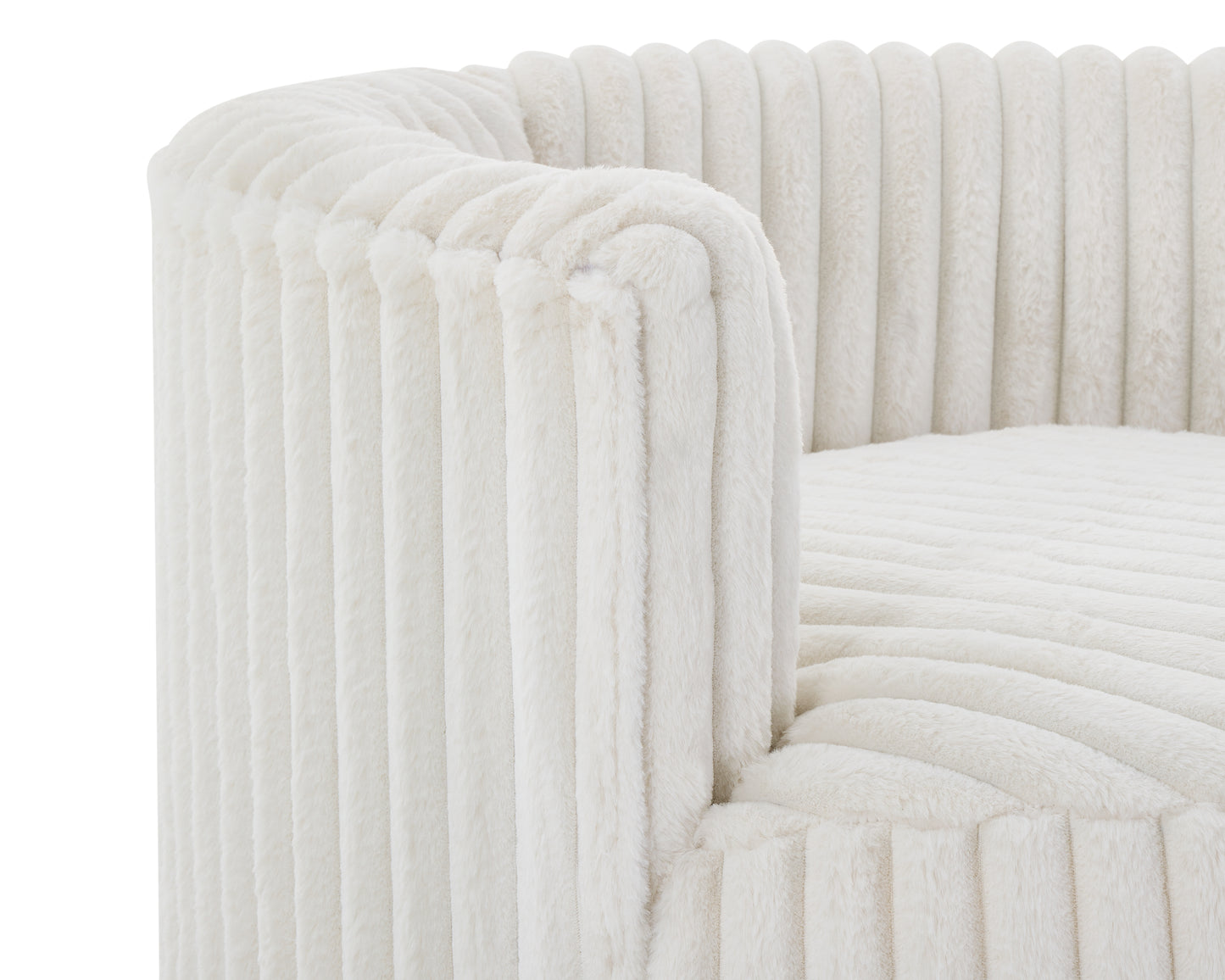 Closeup of a plush cream sofa with vertical ribbed texture