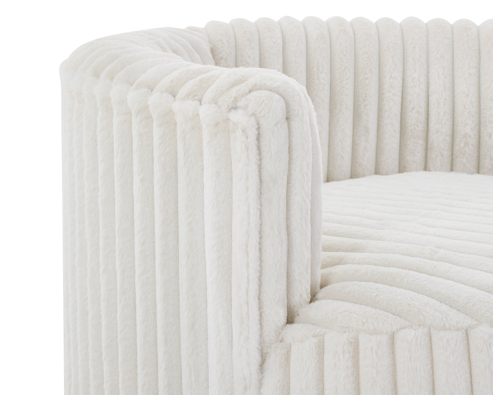 Closeup of a plush cream sofa with vertical ribbed texture