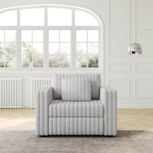 Fluffy textured accent chair in light grey featuring plush upholstery and a ribbed design