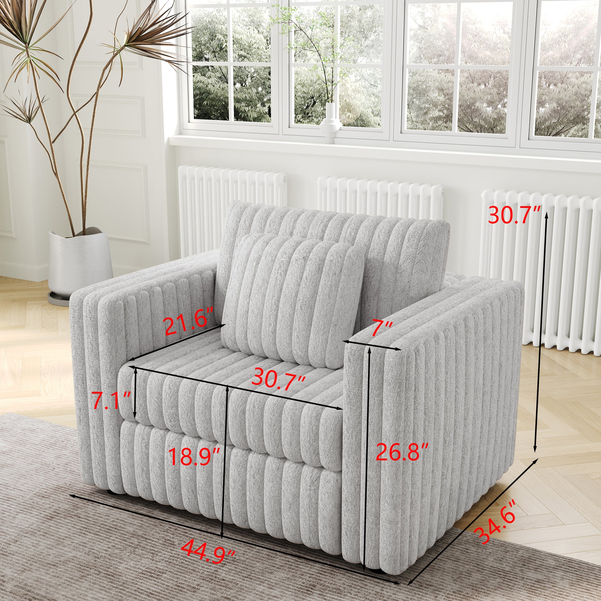 Cozy grey textured armchair with plush fabric featuring ribbed detailing and a matching lumbar pillow