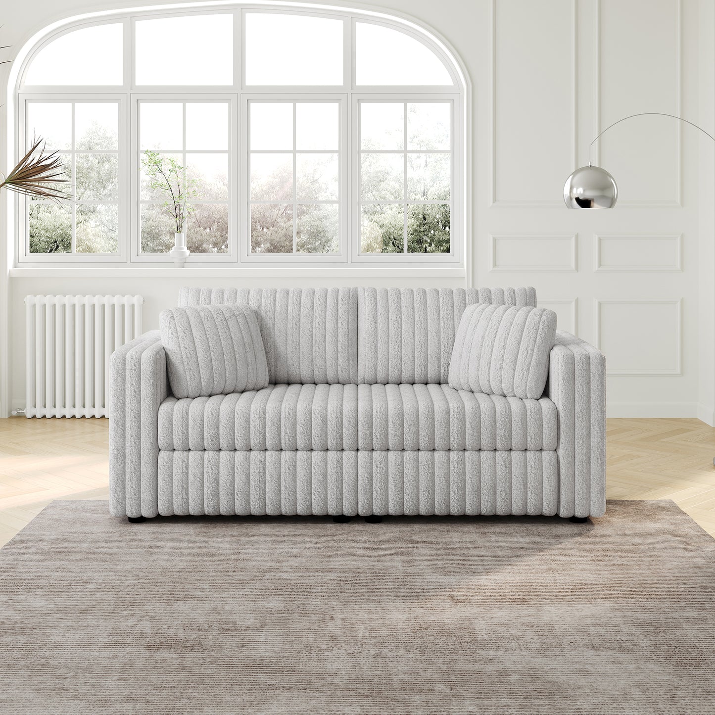 Light grey corduroy sofa with plush cushions in a modern living room setting