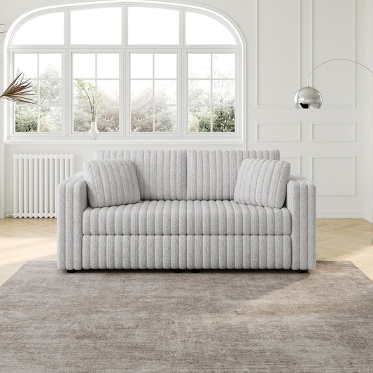 Light grey corduroy sofa with plush cushions in a modern living room setting