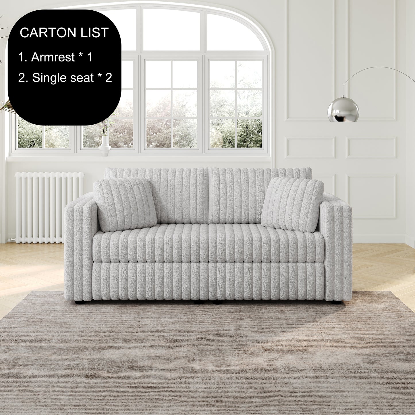 Plush grey sofa with channel tufting and matching throw pillows ideal for a modern living room