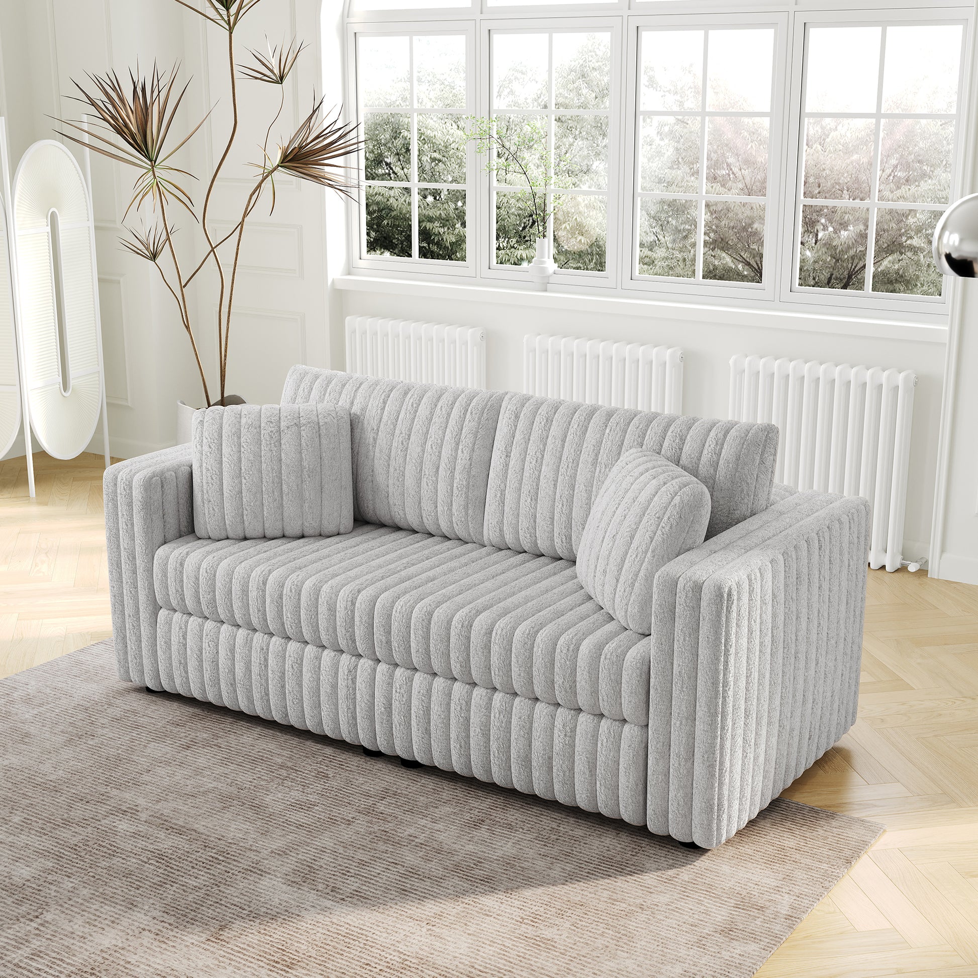 Light gray plush sofa with ribbed texture and matching throw pillows perfect for a modern living room
