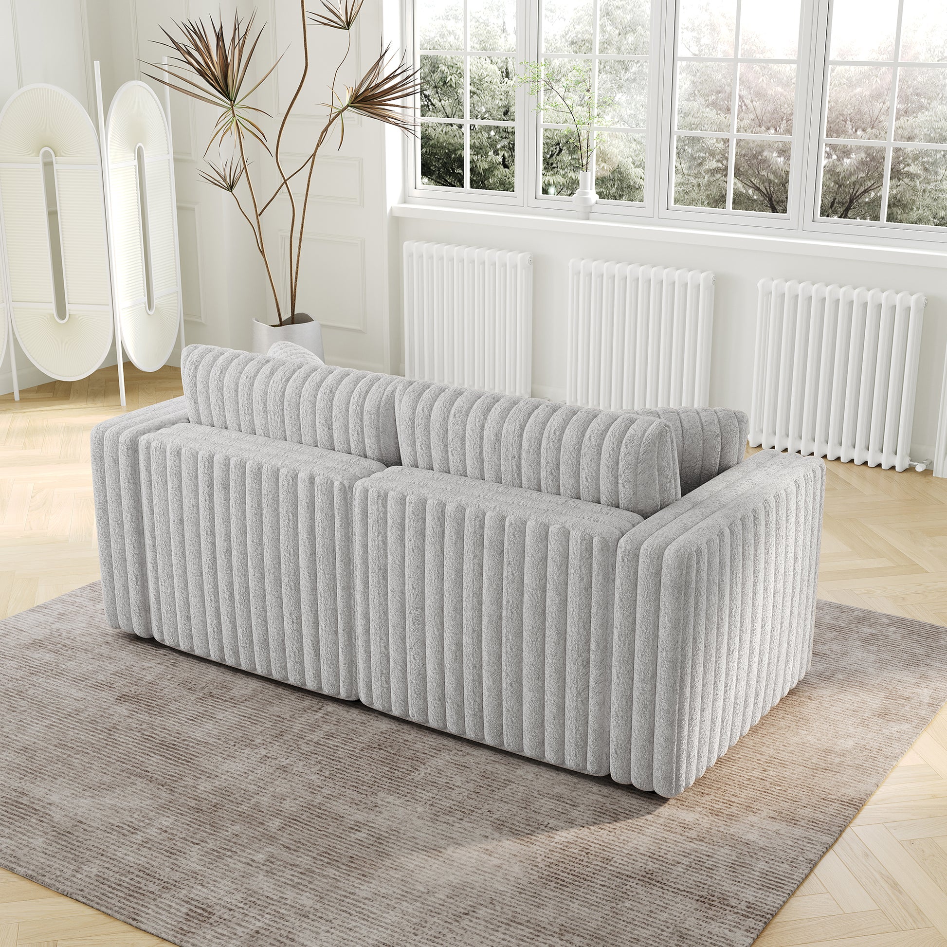 Soft grey fabric couch with vertical channel tufting modern design
