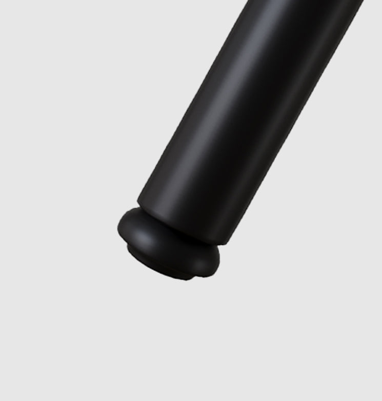 Closeup of a black metal chair leg with a protective rubber foot
