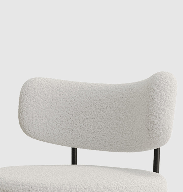 Cream teddy fabric accent chair with curved back and black metal legs
