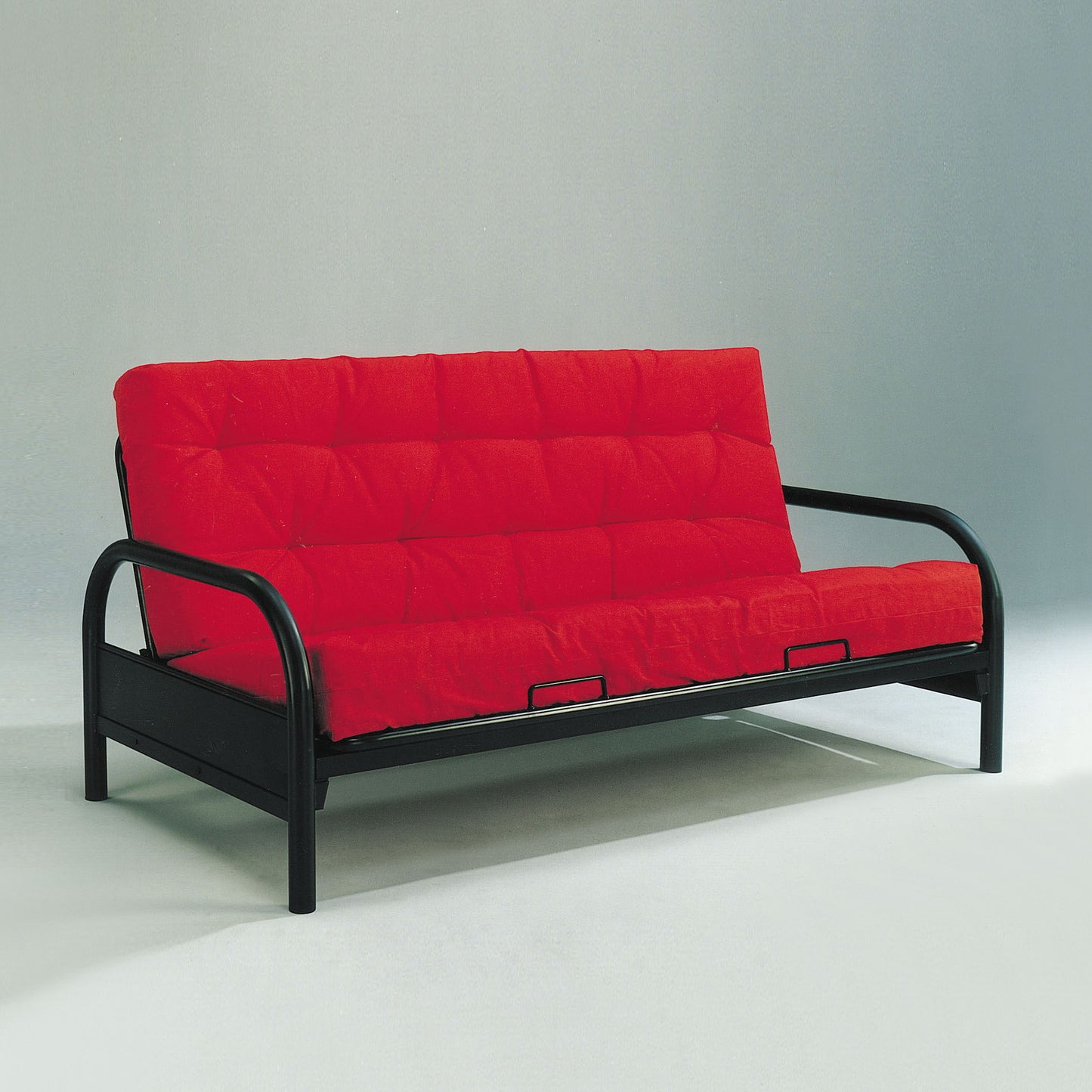 Red futon sofa with black metal frame tufted cushions ideal for small spaces