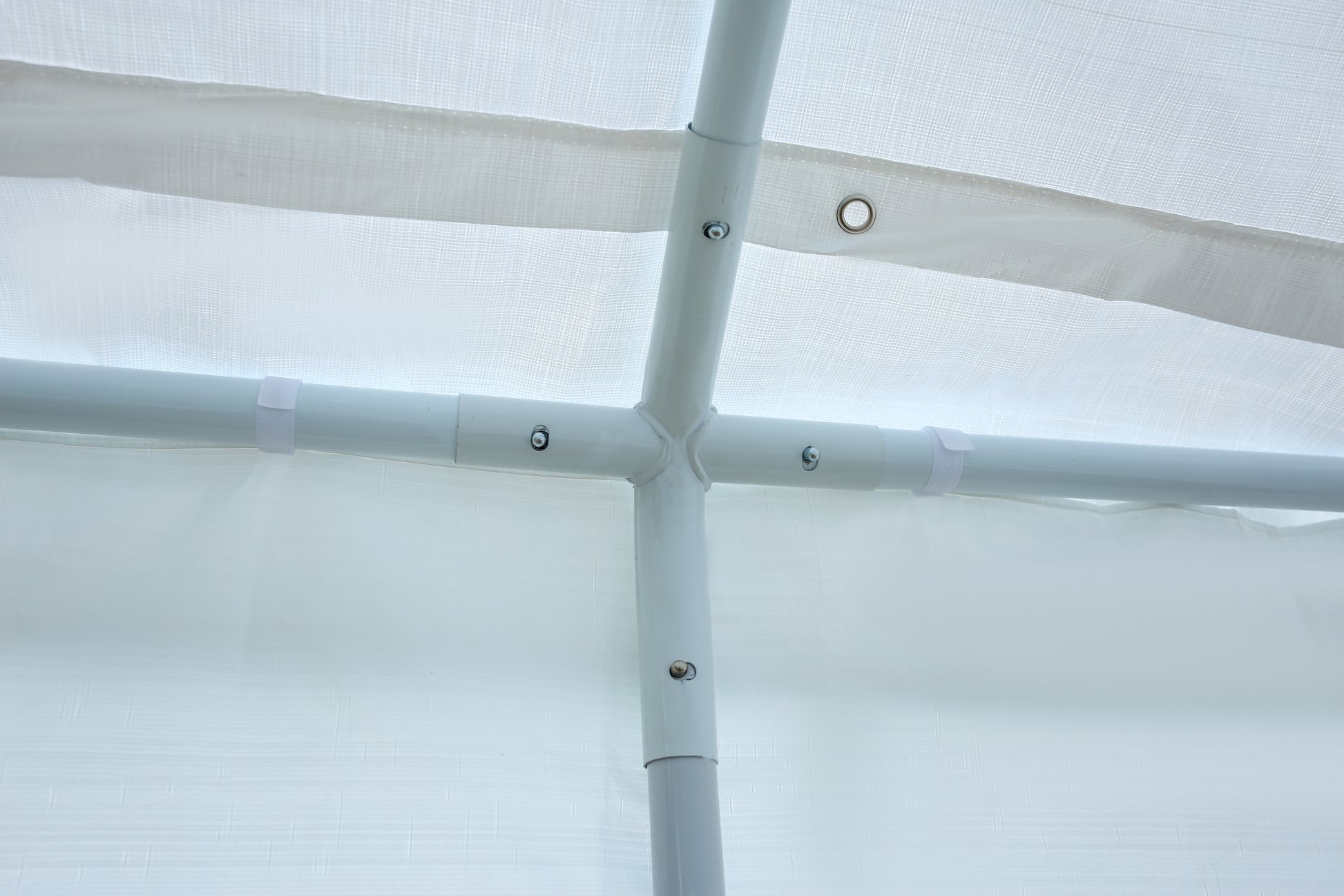White PVC pipe cross fitting for carport structure assembly