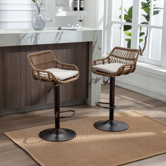 Two natural rattan bar stools with beige cushions and adjustable bronze bases