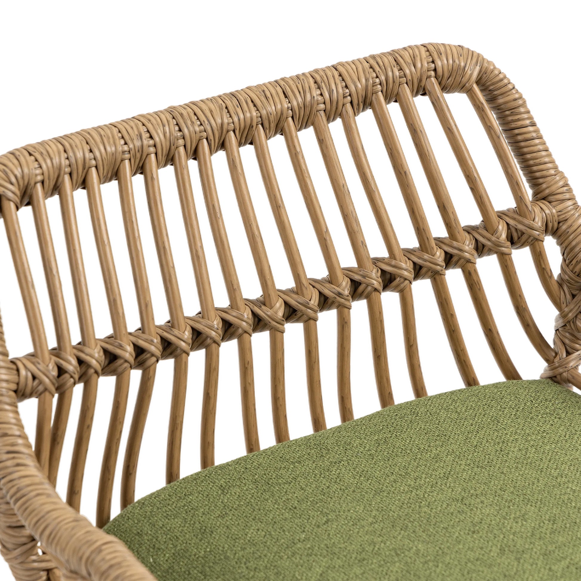 Woven rattan chair back with green textured cushion for outdoor seating