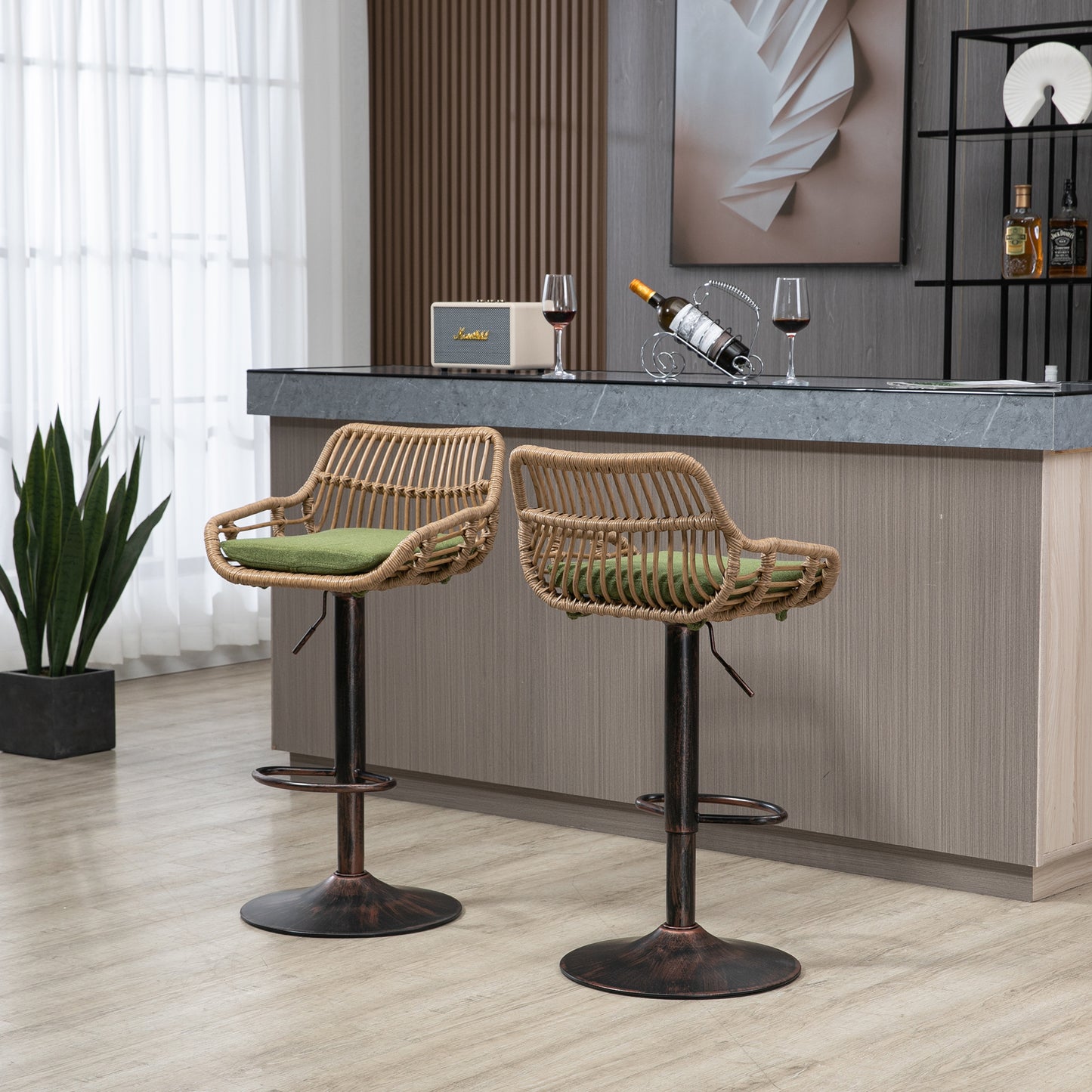 Two natural rattan bar stools with green cushions and adjustable bronze bases