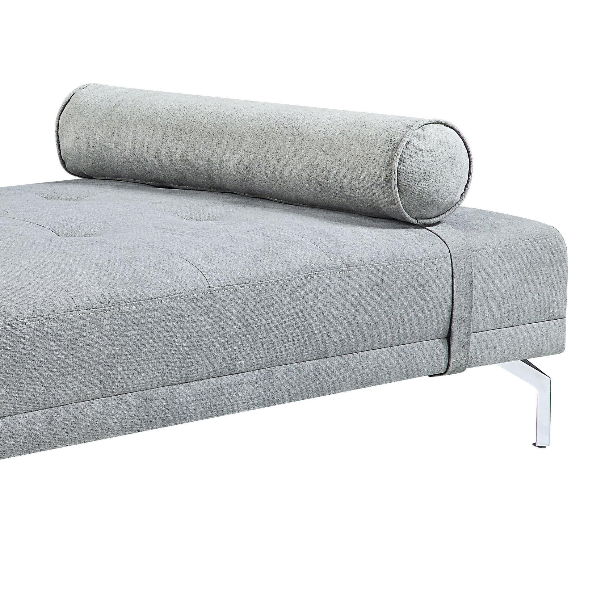 Grey fabric sofa with bolster pillow tufted seat and chrome legs