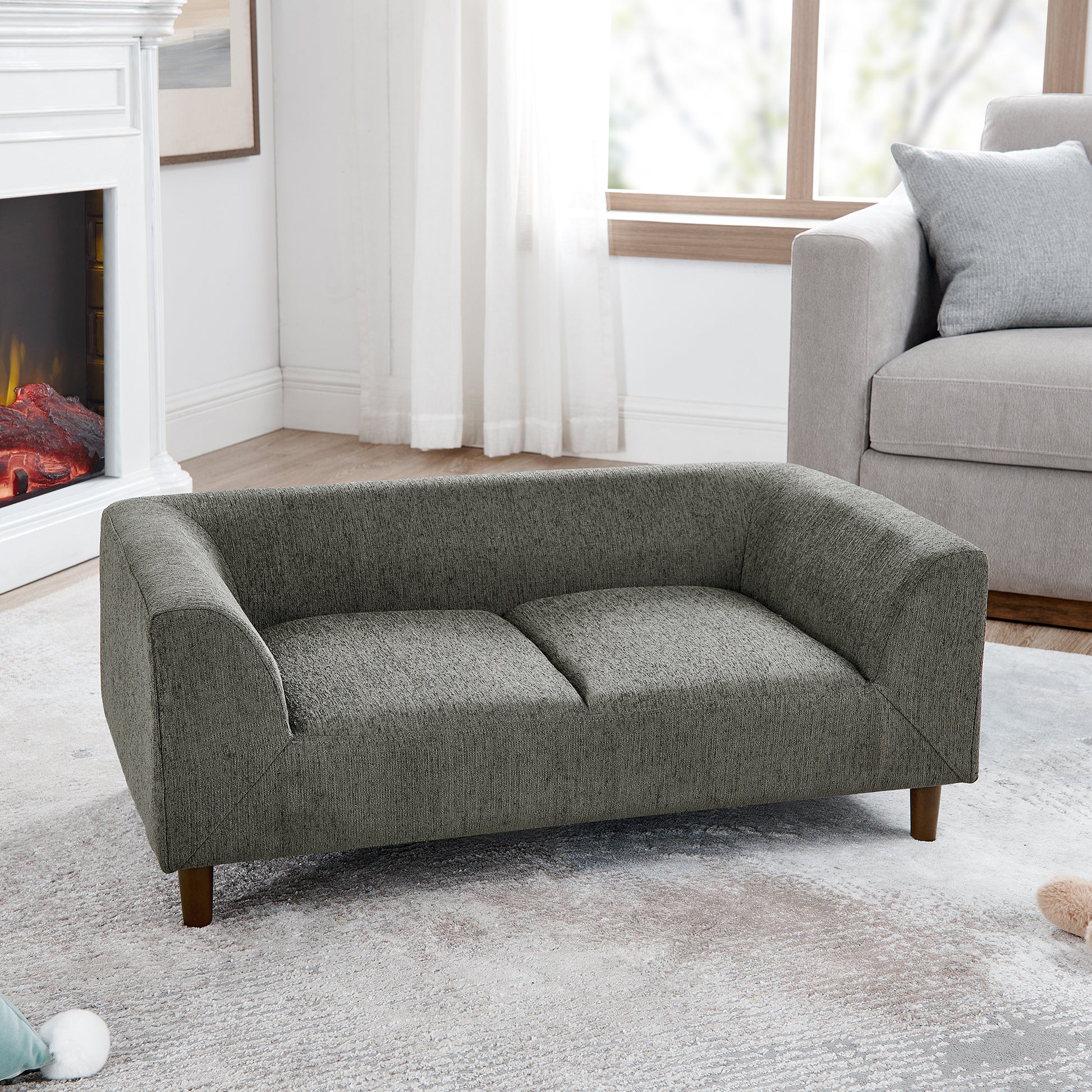 Modern grey fabric dog sofa with wooden legs and plush cushioning