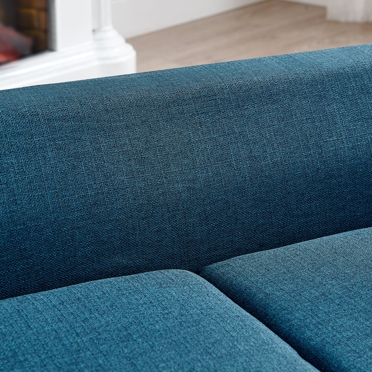 Close up of textured deep blue upholstery on a modern sofa