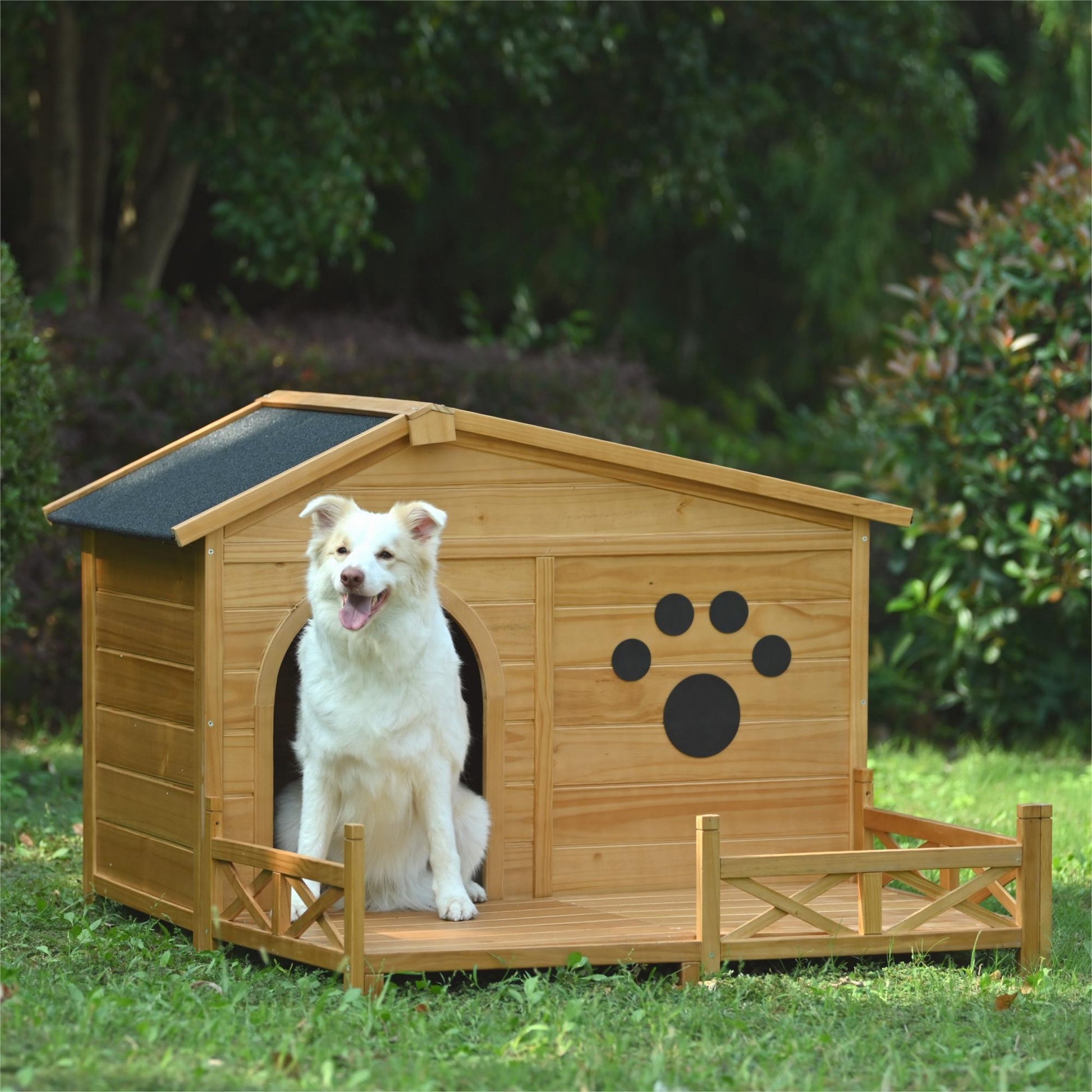 Wooden dog house with porch and paw print detail featuring a happy dog
