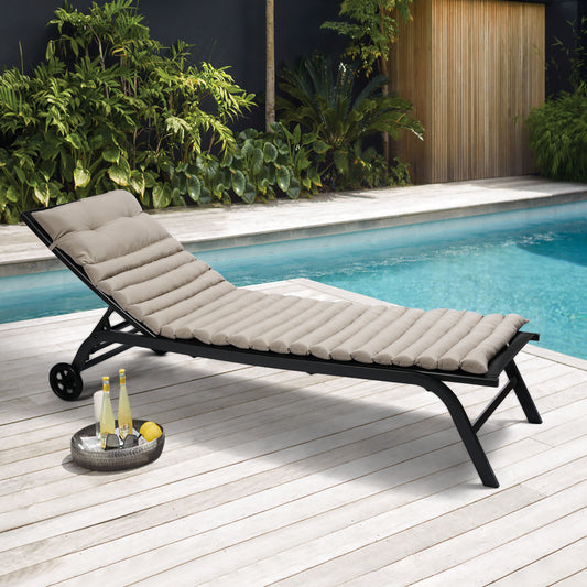 Adjustable patio chaise lounge with plush beige cushions and black metal frame