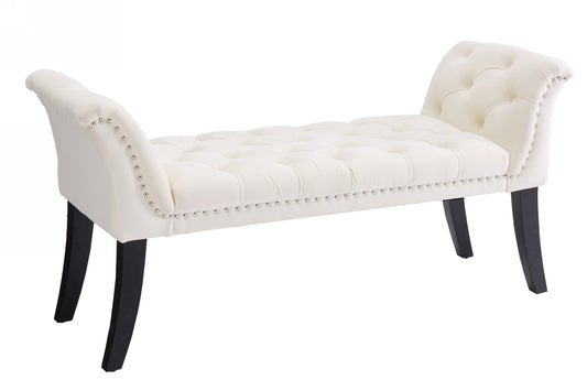 Cream velvet tufted bench with silver nailhead trim and dark wooden legs
