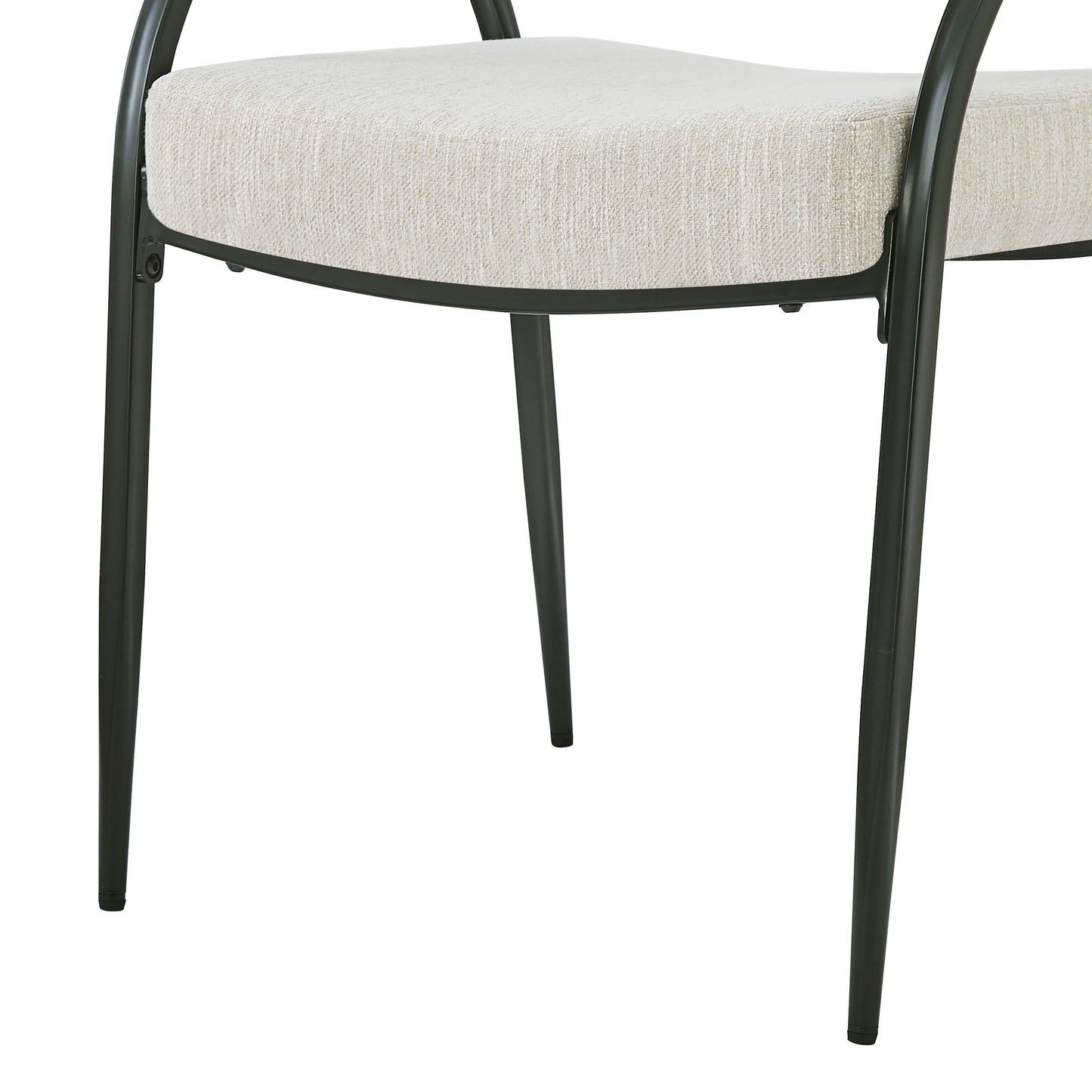 Closeup of a modern black metal chair frame with a textured cream upholstered seat