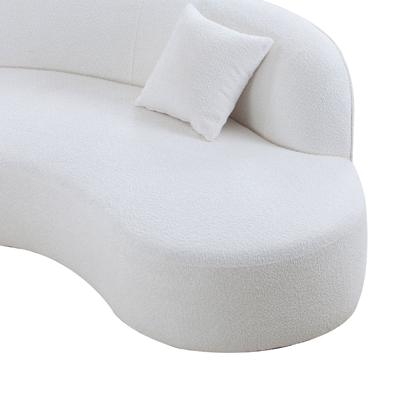 White boucle fabric curved sofa with a single pillow perfect for modern living rooms