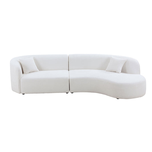 Plush white boucl curved sectional sofa with modern design and two throw pillows