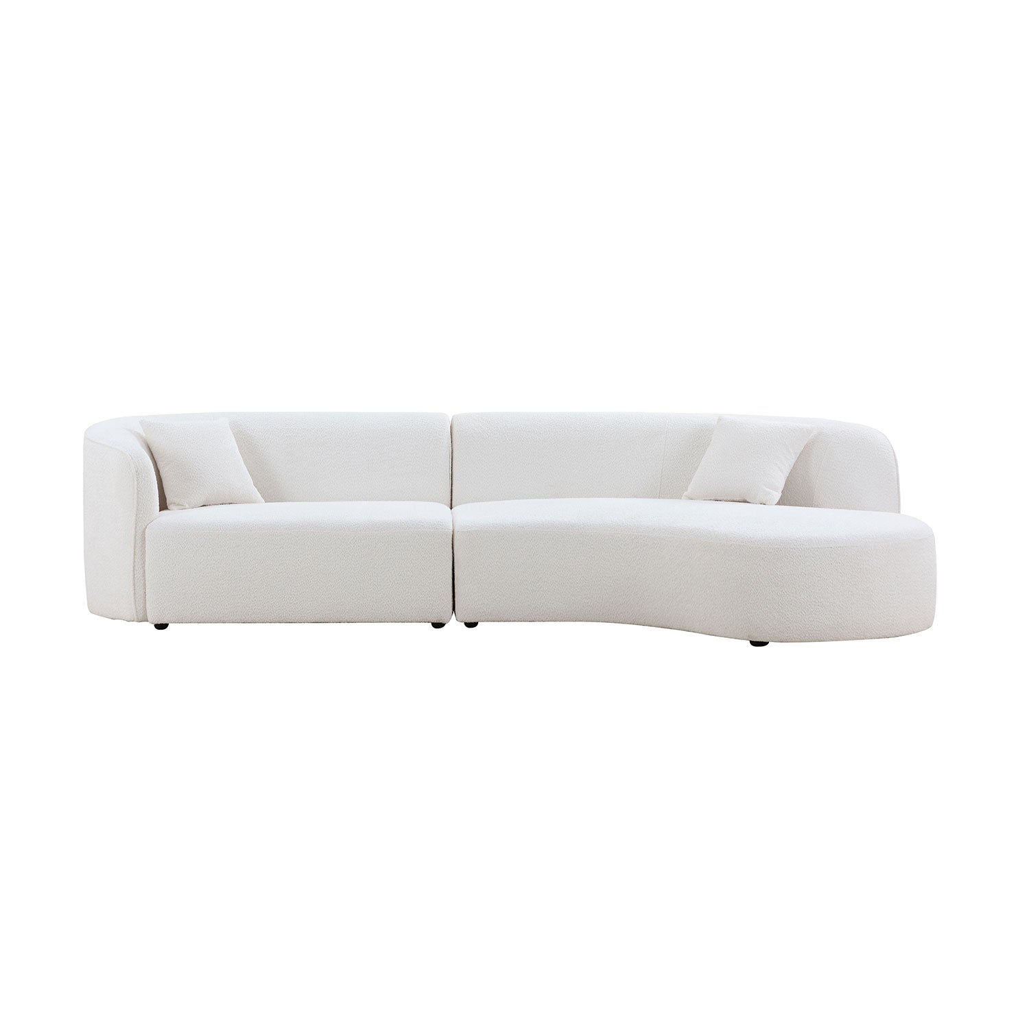 Plush white boucl sectional sofa with curved chaise lounge and two accent pillows