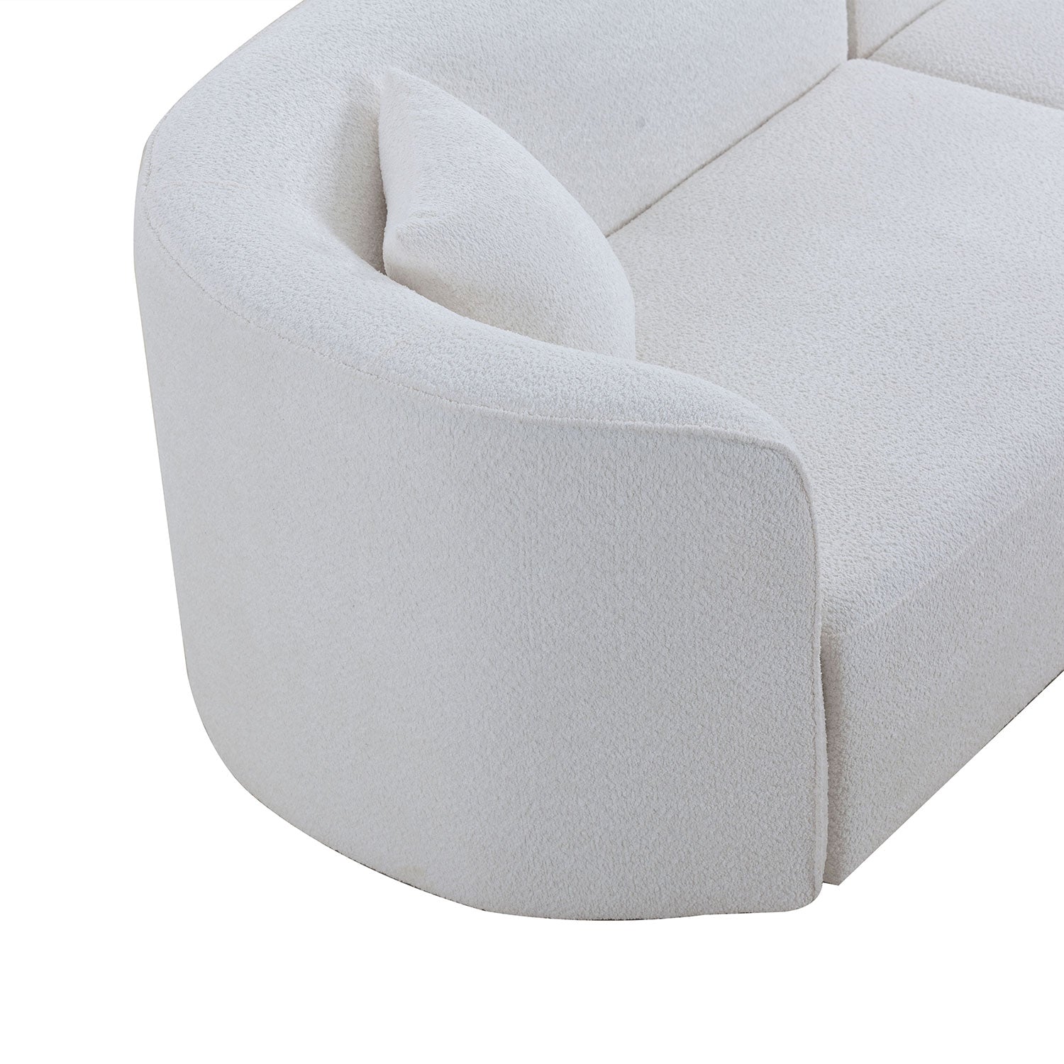 Curved armrest on a plush white boucle sofa offering comfort and modern style