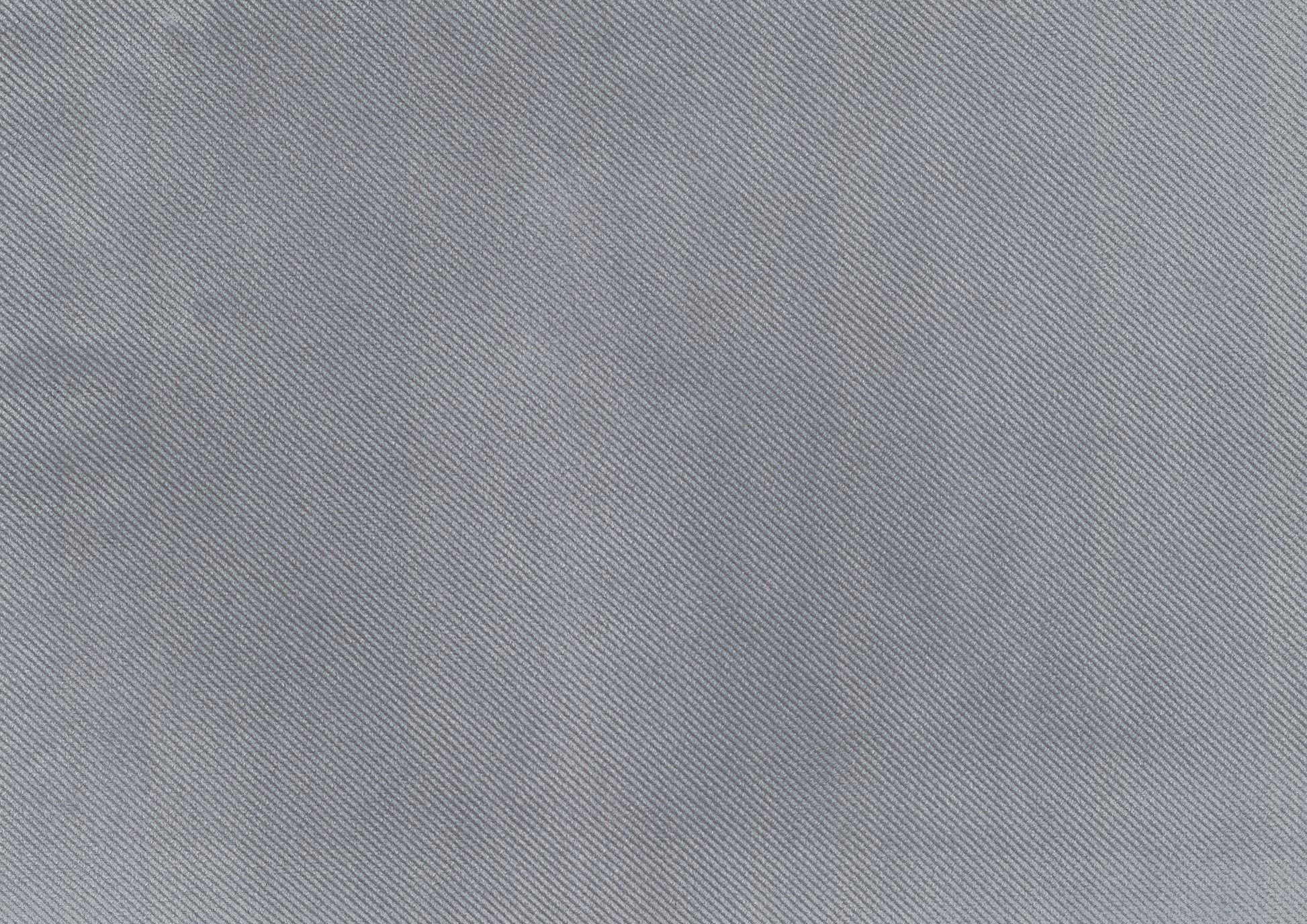 Closeup texture of light gray woven fabric with diagonal ribbed pattern