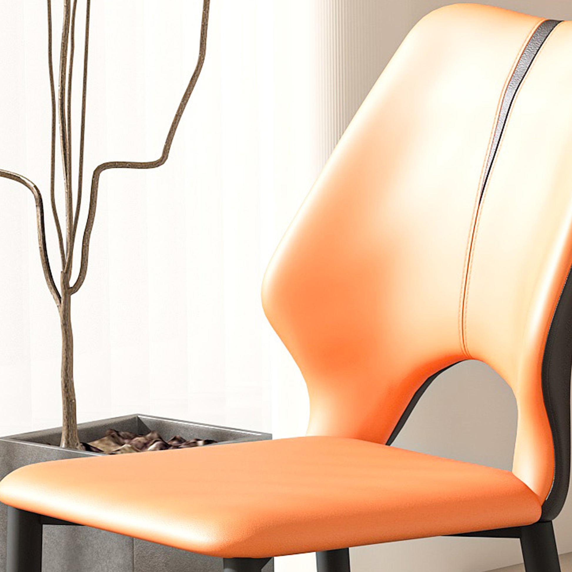 Modern orange leather dining chair with sleek black accents perfect for contemporary kitchens
