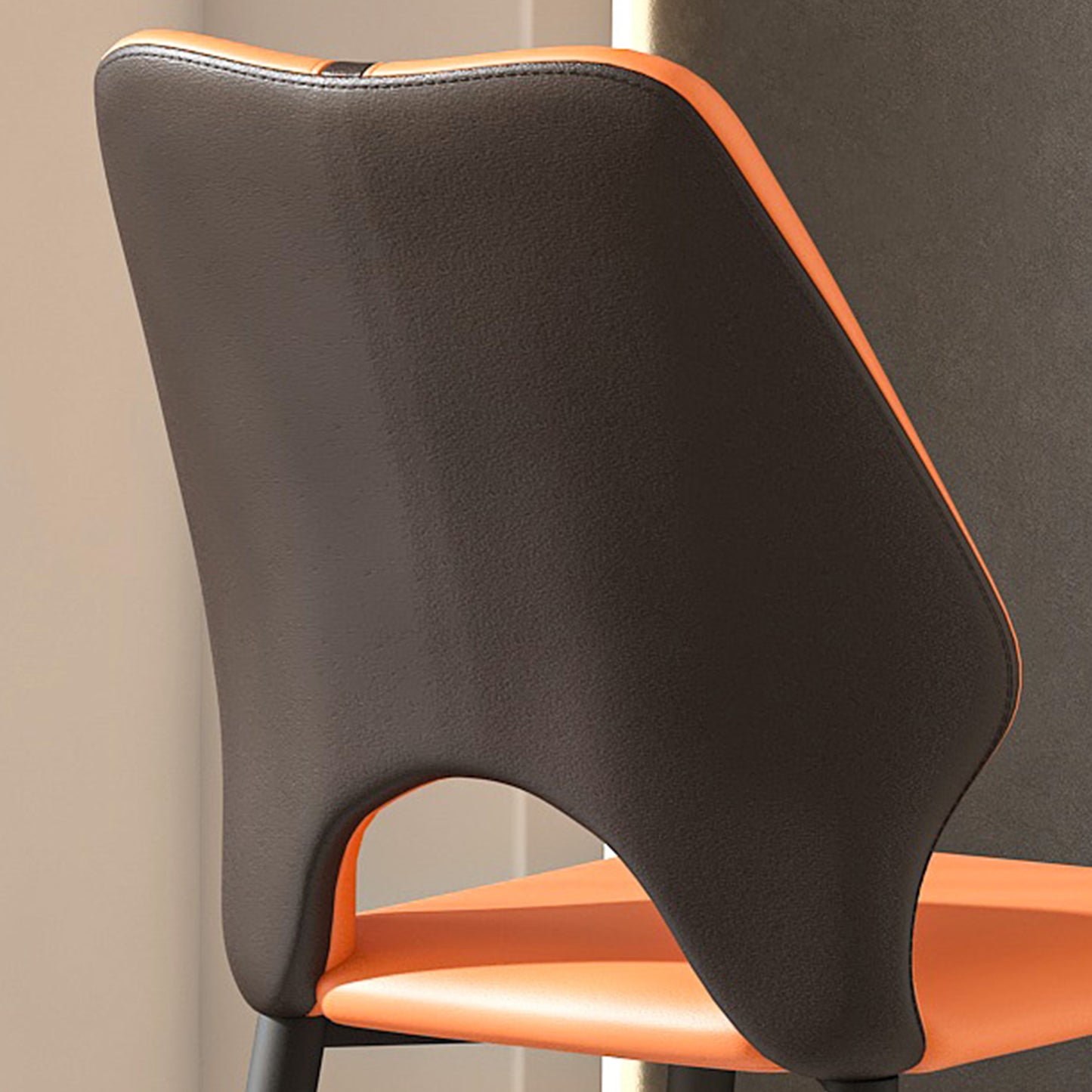 Dark grey leather dining chair with orange seat and back accent