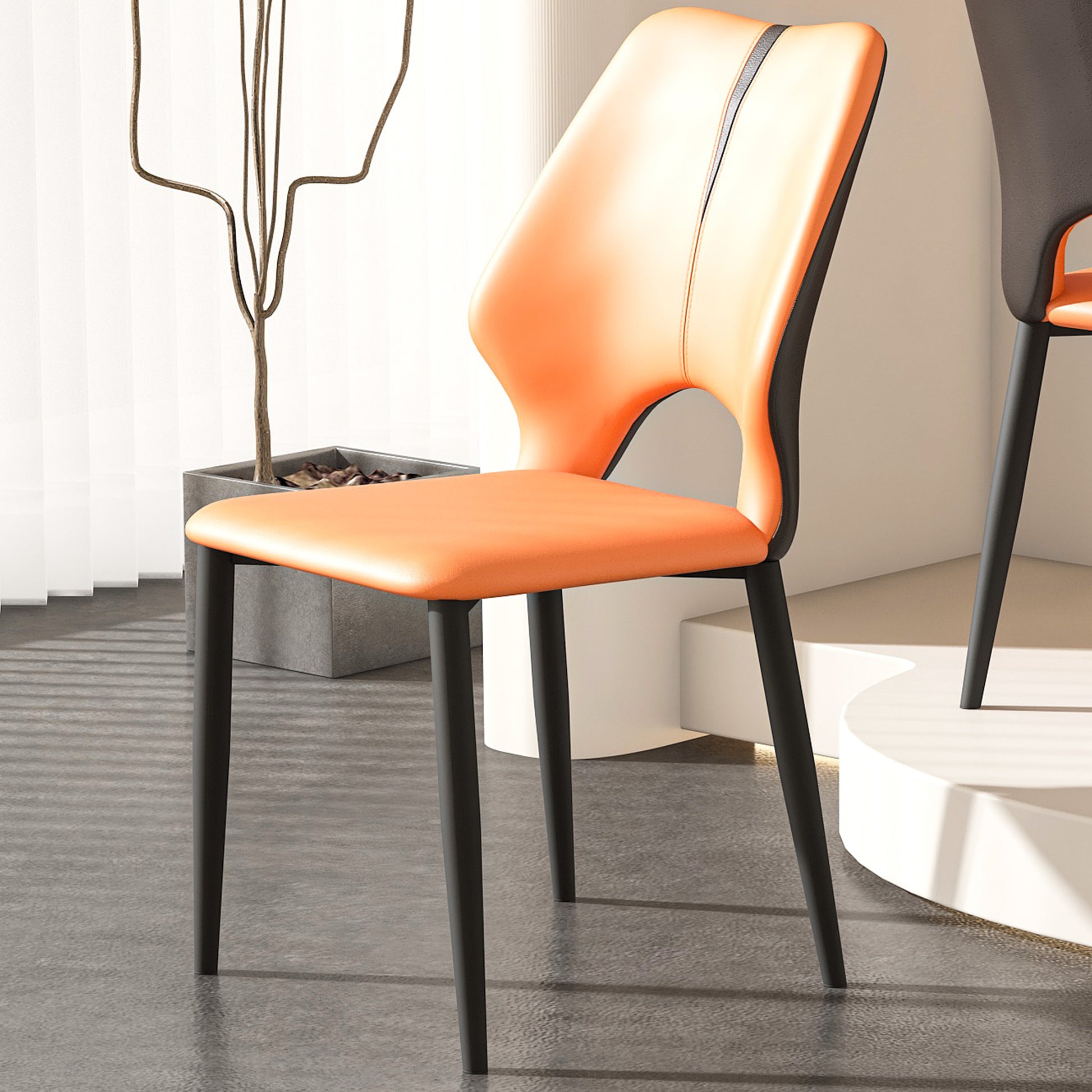 Modern orange faux leather dining chair with black metal legs and lumbar support