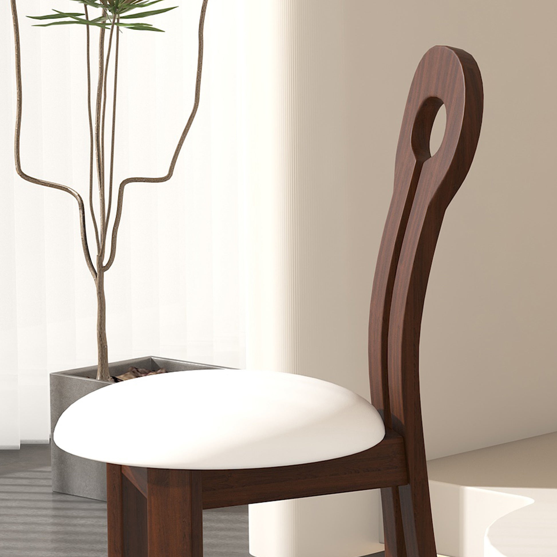 Dark wood accent chair with a round white upholstered seat and curved backrest