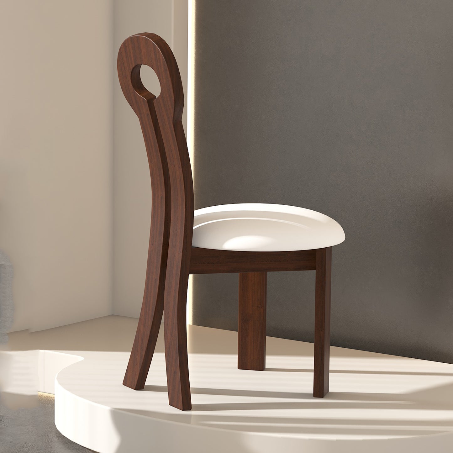 Dark wood accent chair with a circular back detail and white upholstered seat