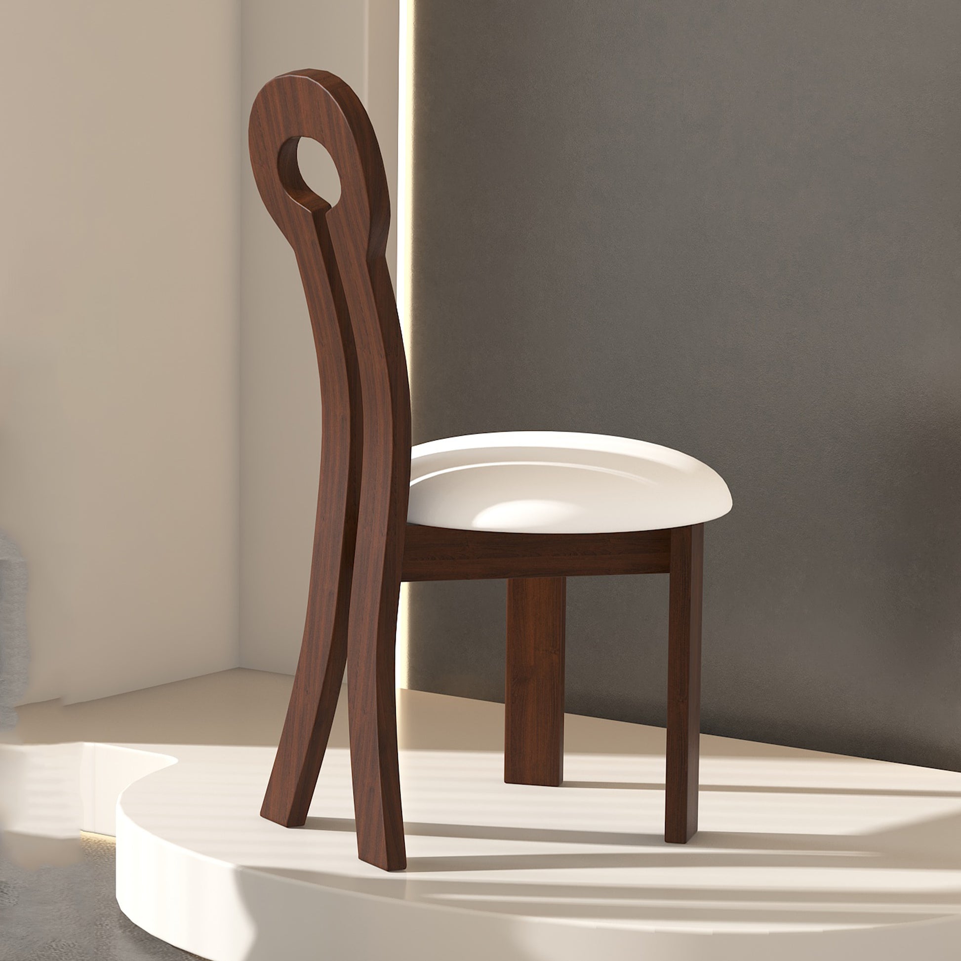 Dark wood accent chair with a circular back detail and white upholstered seat
