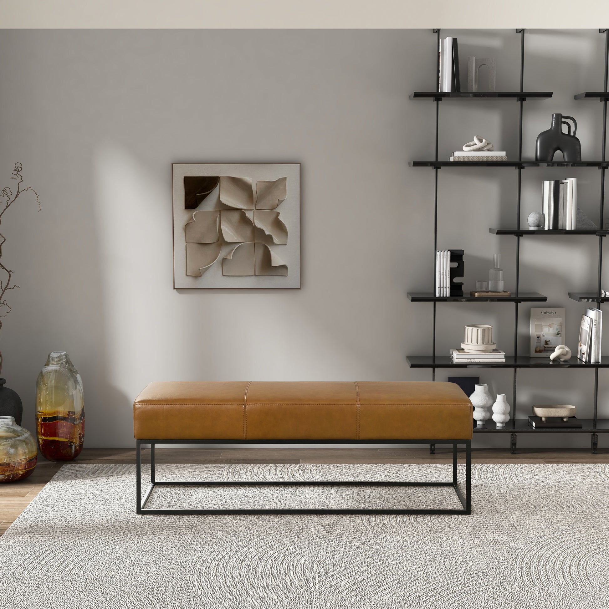 Tan leather bench with stitch detail and black metal frame for modern living rooms