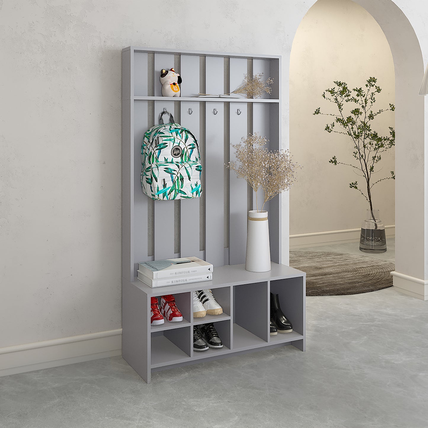 Gray entryway organizer with shoe storage hooks and shelves for backpacks and decor