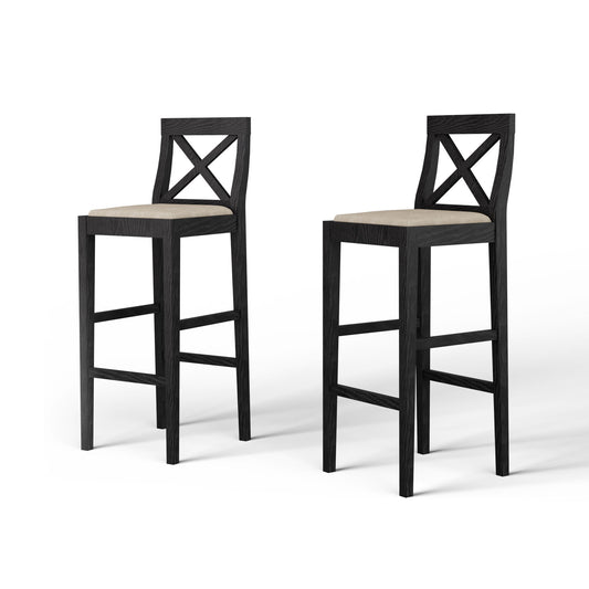 Two dark wood bar stools with beige upholstered seats and Xback design